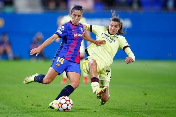 Aitana Bonmati of FC Barcelona is tackled by Tobin Heath of Arsenal during the UEFA Women's Champions League group C match between FC Barcelona and...