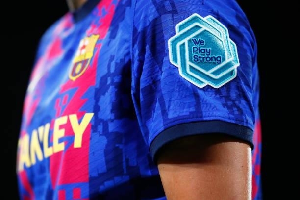 We Play Strong' logo is seen during the UEFA Women's Champions League group C match between FC Barcelona and Arsenal WFC at Estadi Johan Cruyff on...
