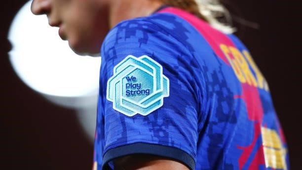 We Play Strong' logo is seen during the UEFA Women's Champions League group C match between FC Barcelona and Arsenal WFC at Estadi Johan Cruyff on...