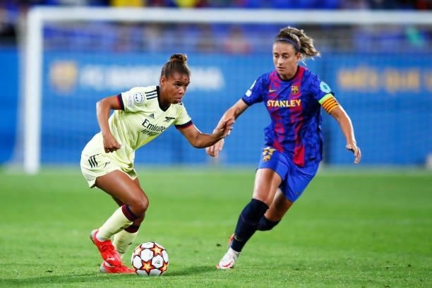 Nikita Parris of Arsenal WFC challenges for the ball against Alexia Putellas of FC Barcelona during the UEFA Women's Champions League group C match...