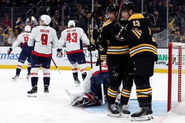 Charlie Coyle of the Boston Bruins celebrates with Craig Smith after scoring a goal against the Washington Capitals during the first period of the...