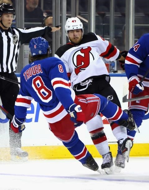 Jacob Trouba of the New York Rangers bounces off Chase De Leo of the New Jersey Devils during the first period during a preseason game at Madison...
