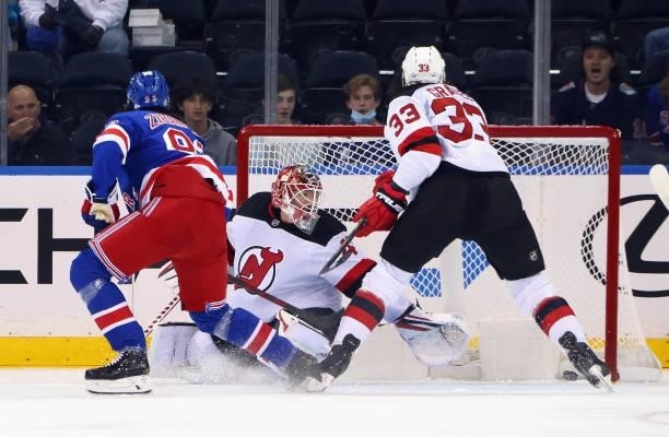 Mika Zibanejad of the New York Rangers scores a first period goal against Jonathan Bernier of the New Jersey Devils during a preseason game at...