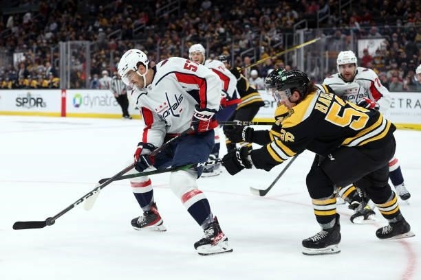 Trevor Van Riemsdyk of the Washington Capitals controls the puck against Erik Haula of the Boston Bruins during the first period of the preseason...