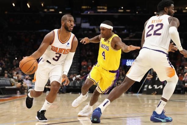 Chris Paul of the Phoenix Suns handles the ball under pressure from Rajon Rondo of the Los Angeles Lakers during the first half of the NBA preseason...