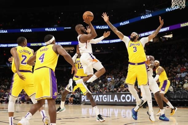 Chris Paul of the Phoenix Suns puts up a shot over Anthony Davis of the Los Angeles Lakers during the second half of the NBA preseason game at...