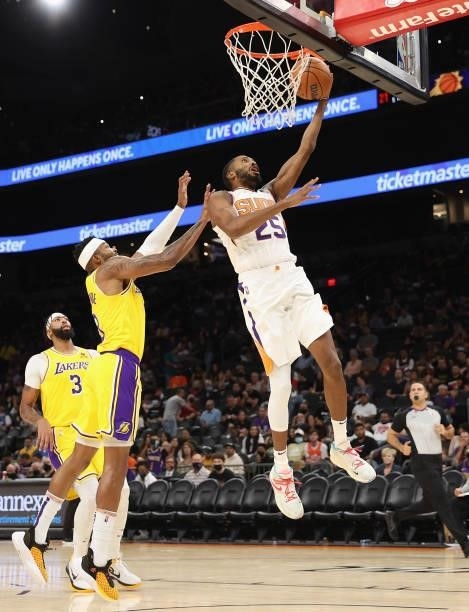 Mikal Bridges of the Phoenix Suns lays up a shot against the Los Angeles Lakers during the NBA preseason game at Footprint Center on October 06, 2021...