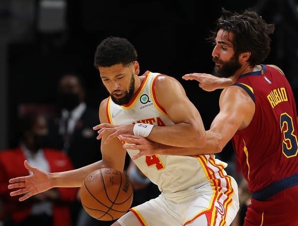 Ricky Rubio of the Cleveland Cavaliers knocks the ball away from Skylar Mays of the Atlanta Hawks during the first half at State Farm Arena on...