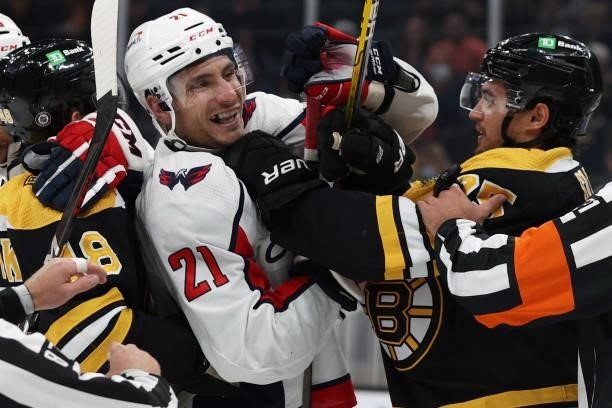 Garnet Hathaway of the Washington Capitals fights with Connor Clifton of the Boston Bruins during the second period of the preseason game at TD...