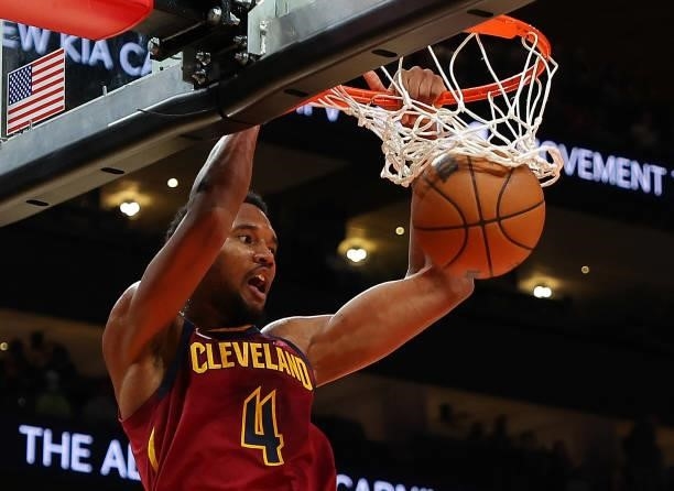 Evan Mobley of the Cleveland Cavaliers dunks against the Atlanta Hawks during the first half at State Farm Arena on October 06, 2021 in Atlanta,...