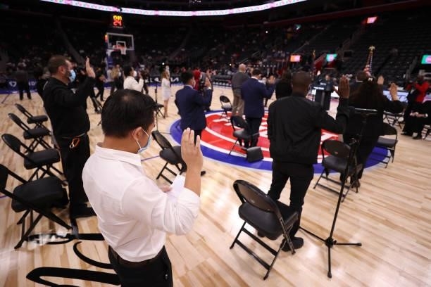 People take the oath to become US citizens naturalization ceremony during halftime of a NBA preseason game between the San Antonio Spurs and Detroit...