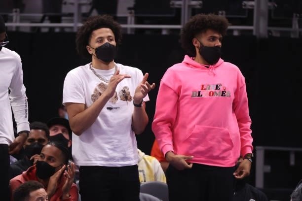 Cade Cunningham and Isaiah Livers of the Detroit Pistons look on during a preaseason game against the San Antonio Spurs at Little Caesars Arena on...
