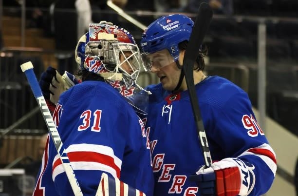Igor Shesterkin and Sammy Blais of the New York Rangers celebrate their 6-2 victory over the New Jersey Devils during a preseason game at Madison...