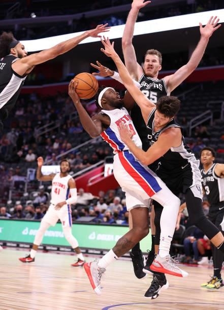 Jerami Grant of the Detroit Pistons tries to get a shot off while playing the San Antonio Spurs during a preseason game at Little Caesars Arena on...