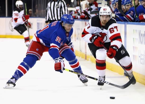 Sammy Blais of the New York Rangers skates against Marian Studenic of the New Jersey Devils during a preseason game at Madison Square Garden on...