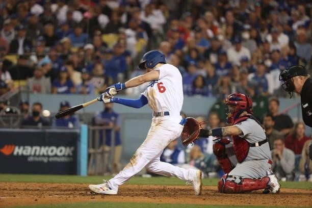 Trea Turner of the Los Angeles Dodgers hits a single in the eighth inning against the St. Louis Cardinals during the National League Wild Card Game...