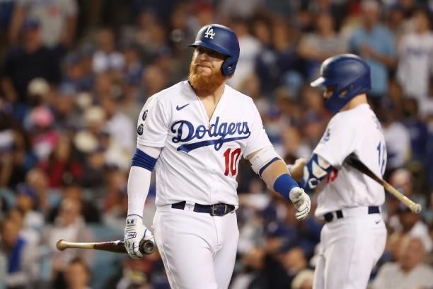 Justin Turner of the Los Angeles Dodgers reacts after striking out in the eighth inning against the St. Louis Cardinals during the National League...