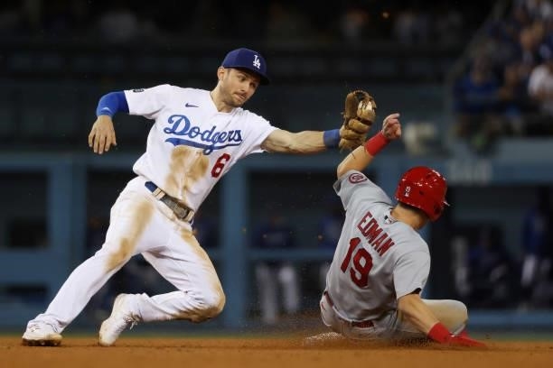 Tommy Edman of the St. Louis Cardinals steals second against Trea Turner of the Los Angeles Dodgers in the ninth inning during the National League...