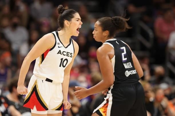 Kelsey Plum of the Las Vegas Aces celebrates after a three-point shot over Megan Walker of the Phoenix Mercury during the second half in Game Four of...