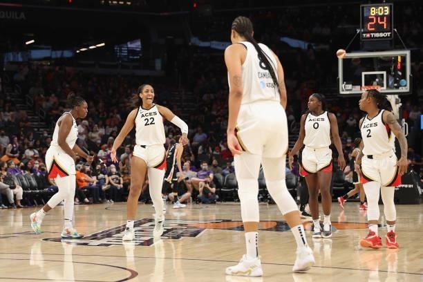 Ja Wilson of the Las Vegas Aces celebrate with teammates after scoring against the Phoenix Mercury during the second half in Game Four of the 2021...