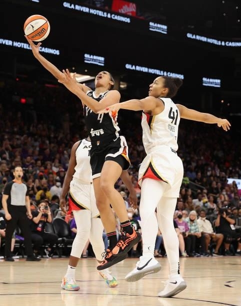 Skylar Diggins-Smith of the Phoenix Mercury lays up a shot past Kiah Stokes of the Las Vegas Aces during the second half in Game Four of the 2021...