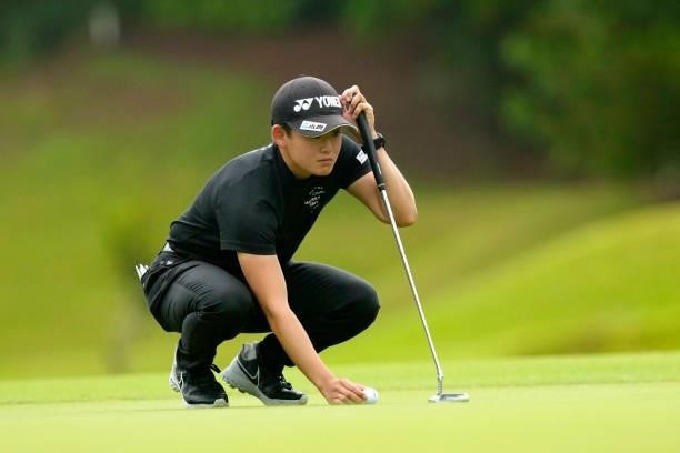 Akie Iwai of Japan lines up a putt on the 1st green during the first round of Kanehide Miyarabi Open at the Kanehide Kise Country Club on October 7,...