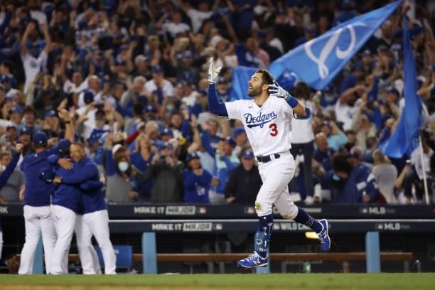 Chris Taylor of the Los Angeles Dodgers celebrates his walk off two-run home run in the ninth inning to defeat the St. Louis Cardinals 3 to 1 during...