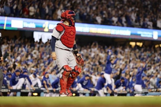 Yadier Molina of the St. Louis Cardinals watches the walk off two-run home run of Chris Taylor of the Los Angeles Dodgers in the ninth inning during...