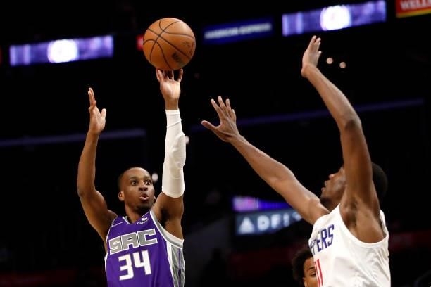 Matt Coleman III of the Sacramento Kings shoots the ball against Moses Wright of the Los Angeles Clippers during the fourth quarter of the preseason...