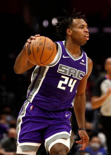 Buddy Hield of the Sacramento Kings dribbles down the court during the third quarter of the preseason game against the Los Angeles Clippers at...