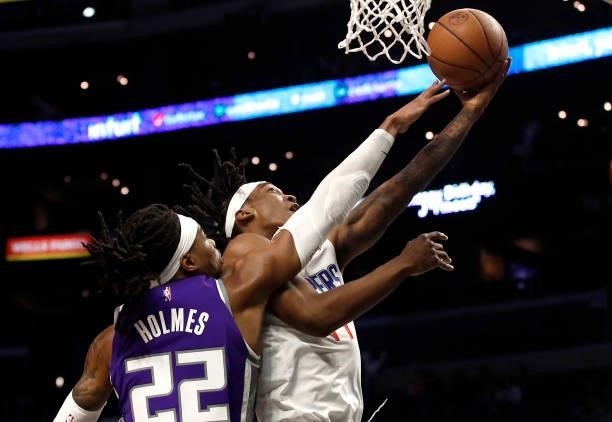 Terance Mann of the Los Angeles Clippers drives to the basket against Richaun Holmes of the Sacramento Kings during the first quarter of the...