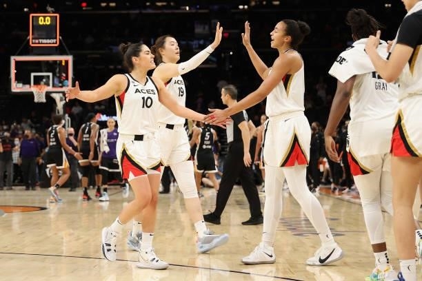 Kelsey Plum, JiSu Park and Kiah Stokes of the Las Vegas Aces celebrate after defeating the Phoenix Mercury in Game Four of the 2021 WNBA semifinals...
