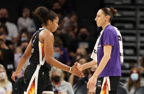Diana Taurasi of the Phoenix Mercury high fives Megan Walker during the final seconds in Game Four of the 2021 WNBA semifinals at Footprint Center on...