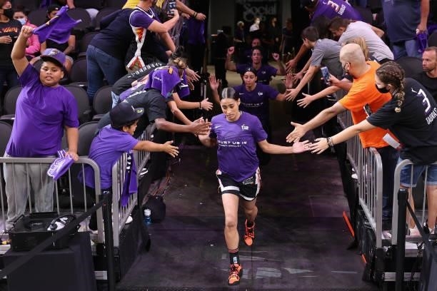 Skylar Diggins-Smith of the Phoenix Mercury high fives fans as runs out for Game Four of the 2021 WNBA semifinals at Footprint Center on October 06,...