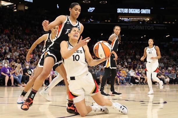 Kelsey Plum of the Las Vegas Aces throws the ball up after falling ahead of Skylar Diggins-Smith of the Phoenix Mercury during the first half in Game...