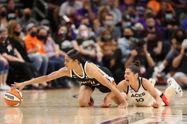 Skylar Diggins-Smith of the Phoenix Mercury attempts to control the ball ahead of Kelsey Plum of the Las Vegas Aces during the first half in Game...