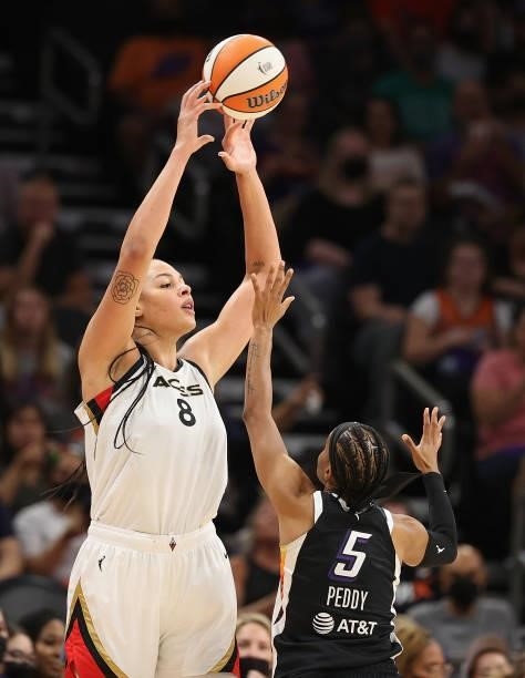 Liz Cambage of the Las Vegas Aces attempts a shot over Shey Peddy of the Phoenix Mercury during the first half in Game Four of the 2021 WNBA...