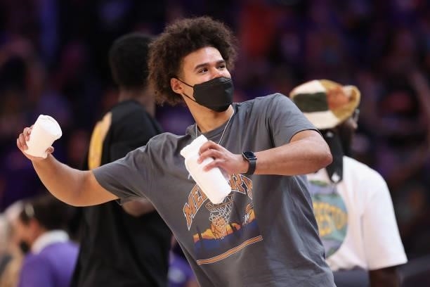 Phoenix Suns player, Cam Johnson throws shirts to fans during a break from Game Four of the 2021 WNBA semifinals between the Phoenix Mercury and the...