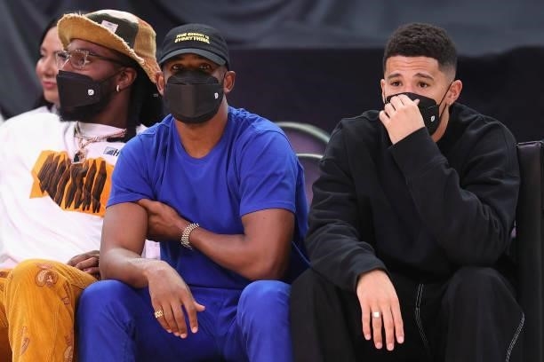 Phoenix Suns players, Jay Crowder, Chris Paul and Devin Booker attend Game Four of the 2021 WNBA semifinals between the Phoenix Mercury and the Las...