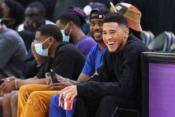 Phoenix Suns players, Chris Paul and Devin Booker attend Game Four of the 2021 WNBA semifinals between the Phoenix Mercury and the Las Vegas Aces at...
