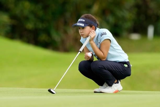 Saho Yamada of Japan lines up a putt on the 9th green during the first round of Kanehide Miyarabi Open at the Kanehide Kise Country Club on October...