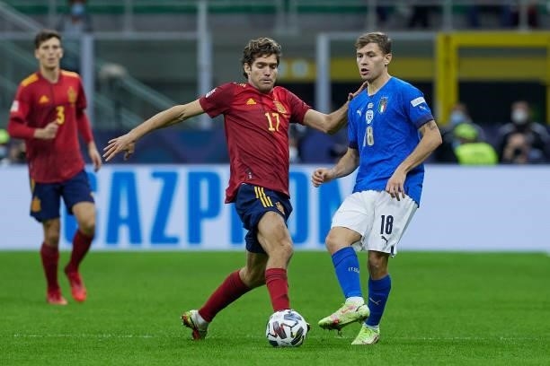 Marcos Alonso of Spain competes for the ball with Nicolo Barella of Italy during the UEFA Nations League 2021 Semi-final match between Italy and...