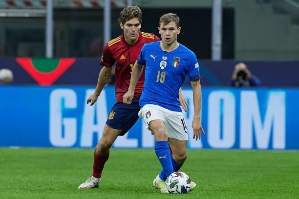 Marcos Alonso of Spain competes for the ball with Nicolo Barella of Italy during the UEFA Nations League 2021 Semi-final match between Italy and...
