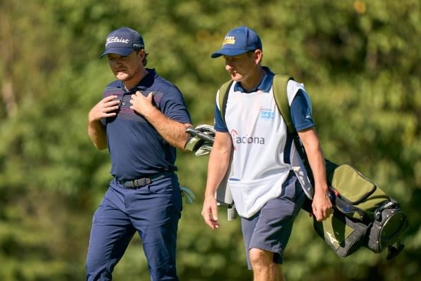 Eddie Pepperell of England talks with his caddie during Day One of The Acciona Open de Espana at Club de Campo Villa de Madrid on October 07, 2021 in...
