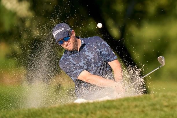 Matthew Southgate of England plays a shot from a bunker during Day One of The Acciona Open de Espana at Club de Campo Villa de Madrid on October 07,...