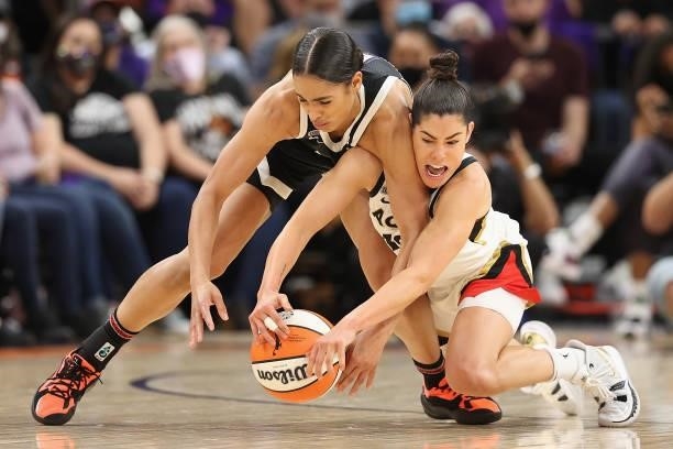 Skylar Diggins-Smith of the Phoenix Mercury and Kelsey Plum of the Las Vegas Aces reach for a loose ball during the first half in Game Four of the...