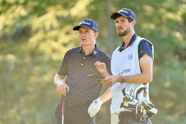 Marcus Kinhult of Sweden talks with his caddie during Day One of The Acciona Open de Espana at Club de Campo Villa de Madrid on October 07, 2021 in...