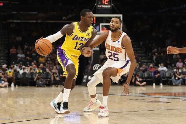 Kendrick Nunn of the Los Angeles Lakers handles the ball against Mikal Bridges of the Phoenix Suns during the NBA preseason game at Footprint Center...