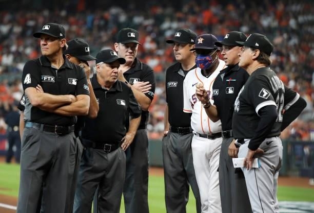 Manager Dusty Baker Jr. #12 of the Houston Astros and Manager Tony La Russa of the Chicago White Sox meet with umpires at home plate prior to Game 1...