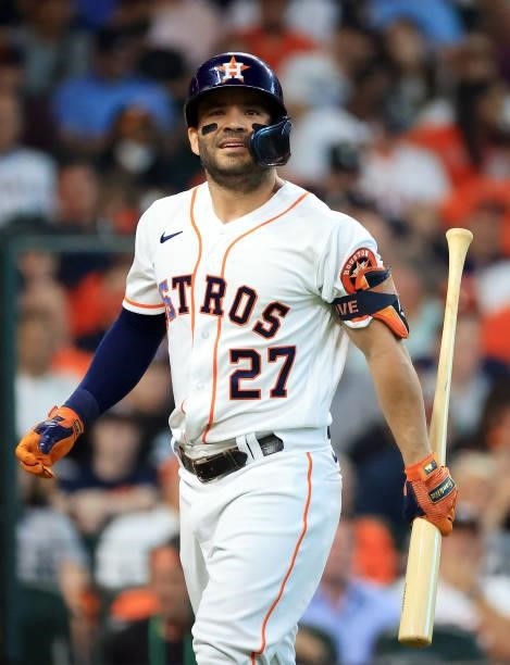 Jose Altuve of the Houston Astros walks back to the dugout after striking out during the 1st inning of Game 1 of the American League Division Series...
